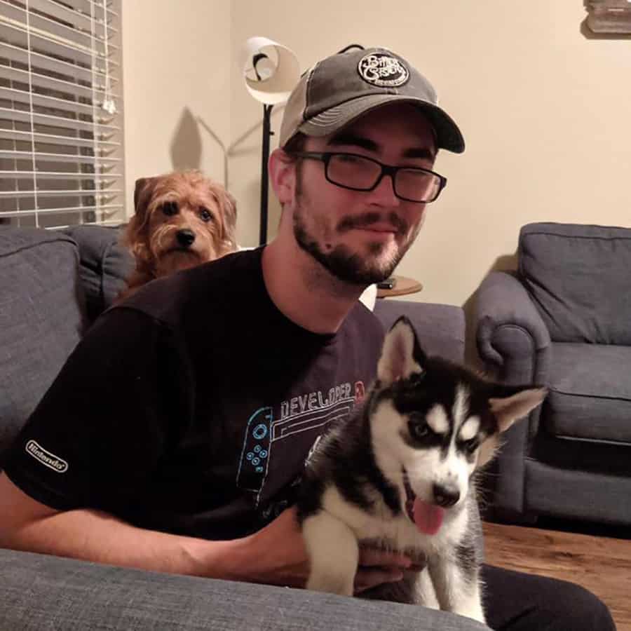 Joe posing with the pups